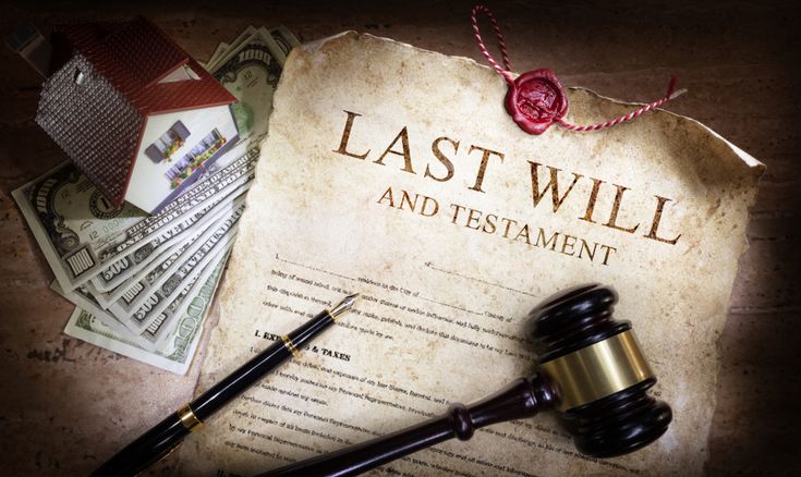 An old key on a will document, representing inheritance law